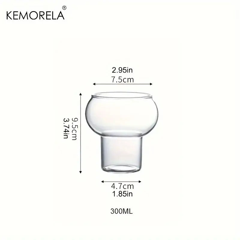 Clear glass cup from gourd shaped glass cup set featuring a rounded bulbous top and short stem with wooden handle