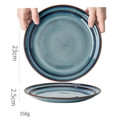 A beautiful blue ceramic dinnerware dish features a 23cm ceramic bowl with gradient glaze and subtle brown rim