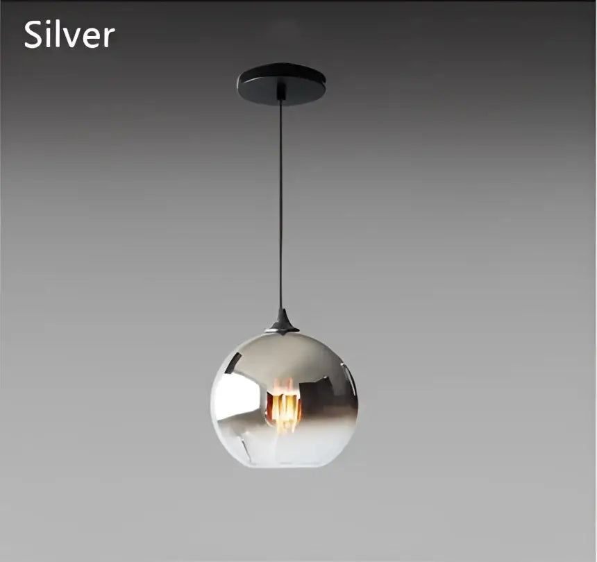 Silver spherical pendant light with reflective gradient glass ball and black metal suspension for dining room chandelier