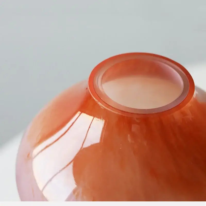 A translucent amber gradient glass vase with a smooth rounded body and flared rim from decorbites gradient glass set