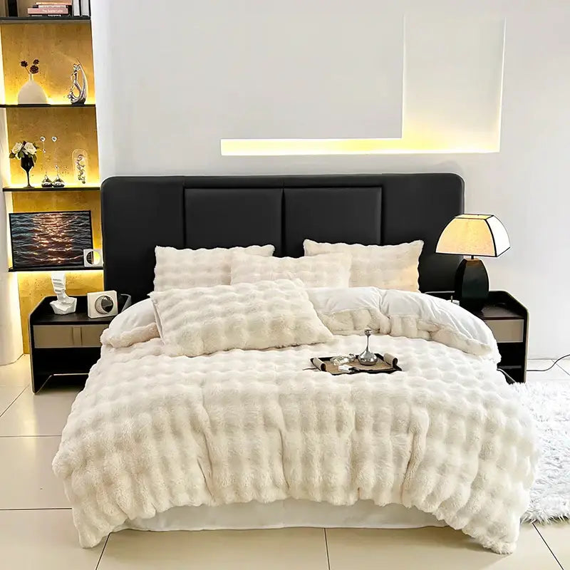Cream-colored plush faux fur bedding set with quilted texture and matching pillows from decorbites gradient gray faux collection