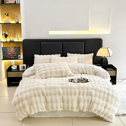 Cream-colored plush faux fur bedding set with quilted texture and matching pillows from decorbites gradient gray faux collection