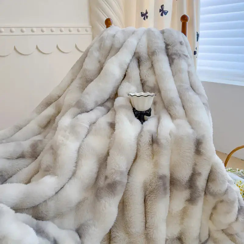 A plush gradient grey cashmere fleece chunky knit throw blanket with a soft white and grey textured surface for decorbites decor