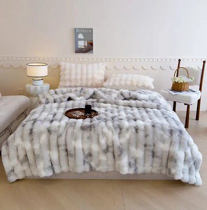 A plush gradient grey cashmere fleece chunky knit throw blanket with soft textured surface for bedroom decorbites decor