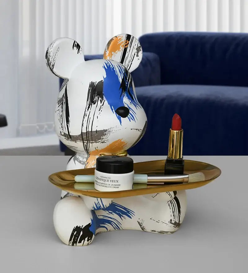 White bear figurine with bold black blue and orange brushstrokes holds gold tray for living room decorbites graffiti bear storage