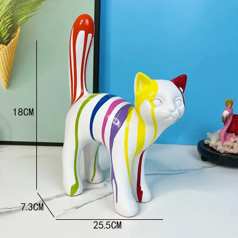 A vibrant white ceramic graffiti cat desk storage statue with colorful stripes and a red-tipped tail for desk storage