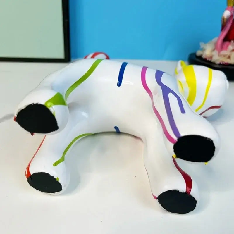 White ceramic graffiti cat desk storage statue with vibrant multicolored stripes for black and white living room decor