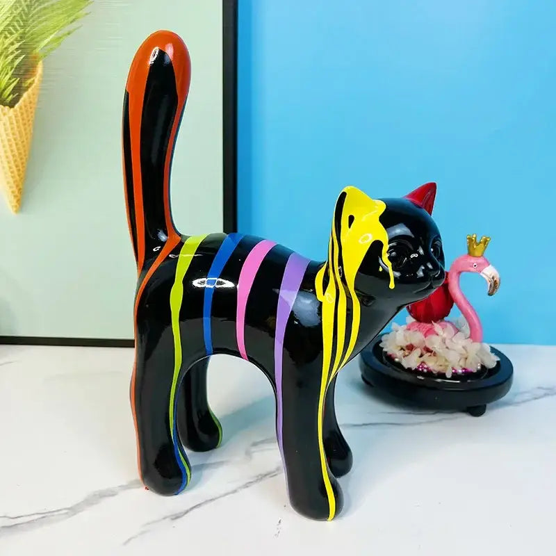 A glossy black graffiti cat desk storage statue with vibrant rainbow stripes for black and white living room decor