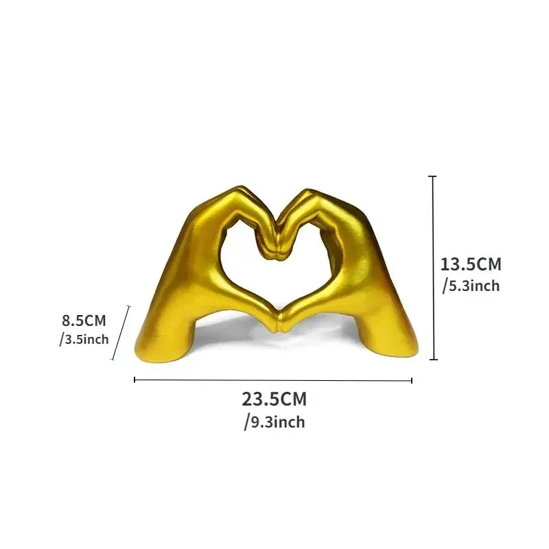 Golden metallic sculpture of two hands forming a heart shape in resin ornaments for colorful love office decorbites colorful love