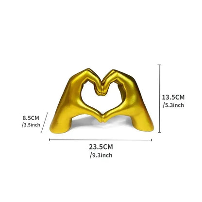 Golden metallic sculpture of two hands forming a heart shape in resin ornaments for colorful love office decorbites colorful love