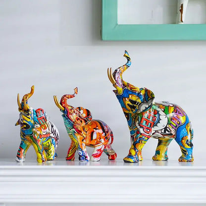 Three vibrantly painted decorbites elephant resin figurines with comic book design for living room home decor