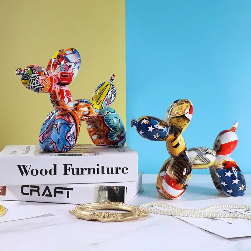 Two colorful graffiti-style resin balloon dog figurines with vibrant patterns perfect for home decor