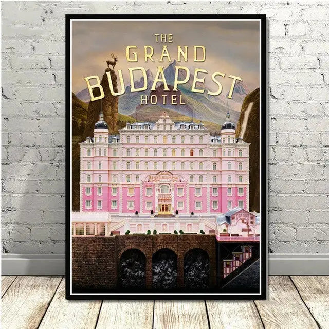 A framed decorbites grand budapest hotel minimalist wall art featuring a pink facade and ornate architecture