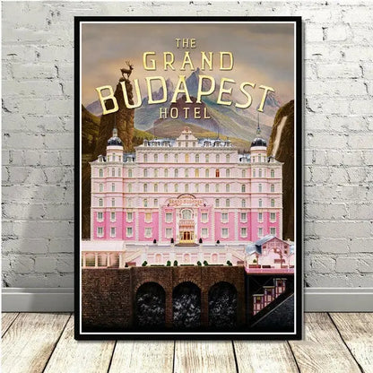 A framed decorbites grand budapest hotel minimalist wall art featuring a pink facade and ornate architecture