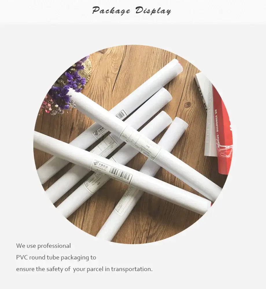 White pvc round tubes neatly rolled and labeled for decorbites grand budapest hotel minimalist wall art set packaging