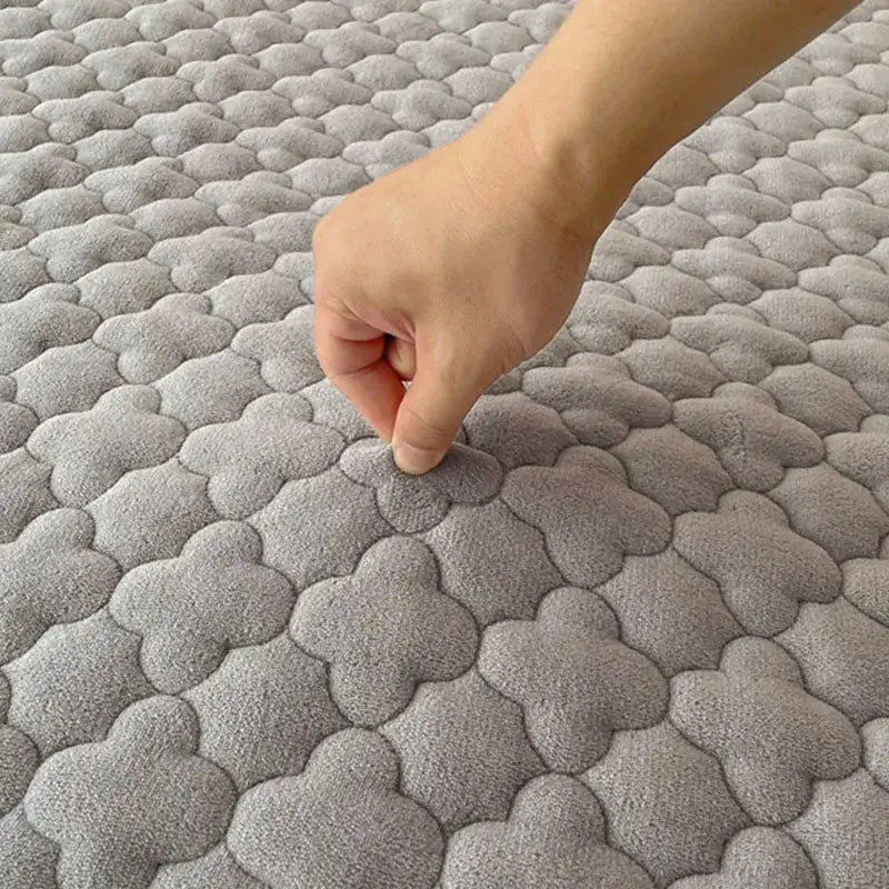 Gray and white antibacterial milk velvet mattress pad with plush quilted texture and cloud-like pattern by decorbites antibacterial milk