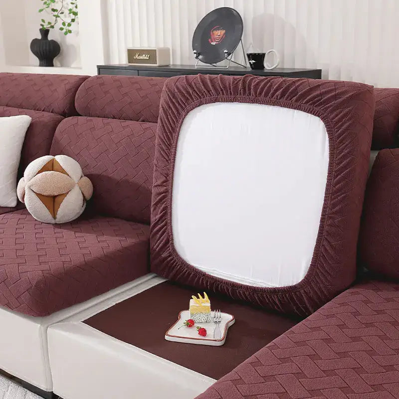 Maroon woven fabric sofa cover with elasticized edges and white central panel for living room slipcover