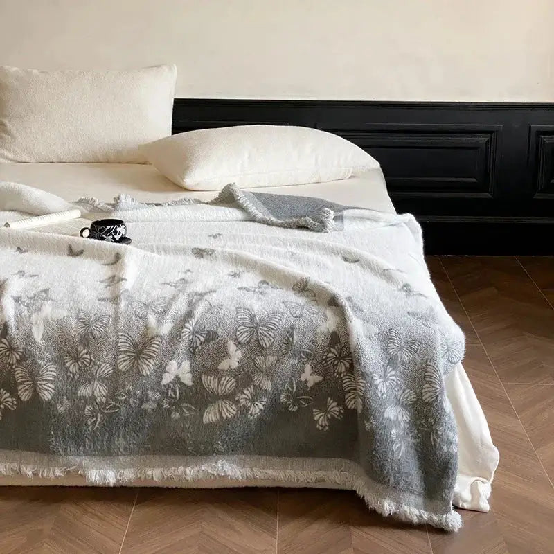 Gray butterfly jacquard imitation mink fur blanket with delicate butterfly pattern and frayed edges for bedroom decor