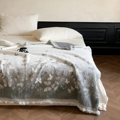 Gray butterfly jacquard imitation mink fur blanket with delicate butterfly pattern and frayed edges for bedroom decor