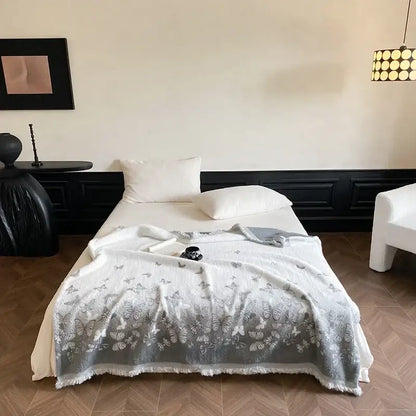 A soft white bedroom throw blanket with gray butterfly jacquard imitation mink fur and frayed edges decorbites butterfly jacquard
