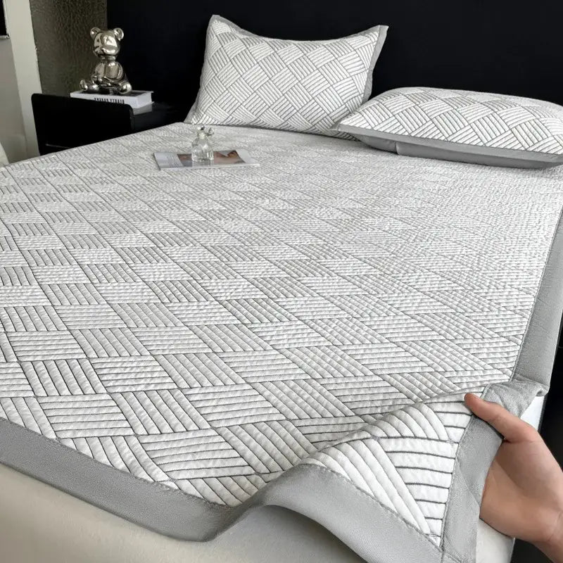 Gray cooling ice bean mesh quilted mattress pad with subtle geometric pattern and soft padded edges by decorbites cooling ice