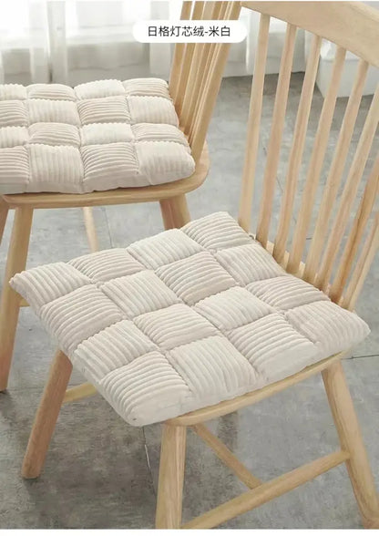 Cream-colored quilted corduroy cushion with grid pattern for dining room chair by decorbites corduroy cushion