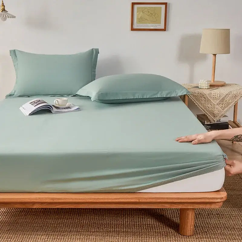 Soft mint green decorbites cotton fitted sheet with smooth texture and elastic edge in a bedroom sheet set