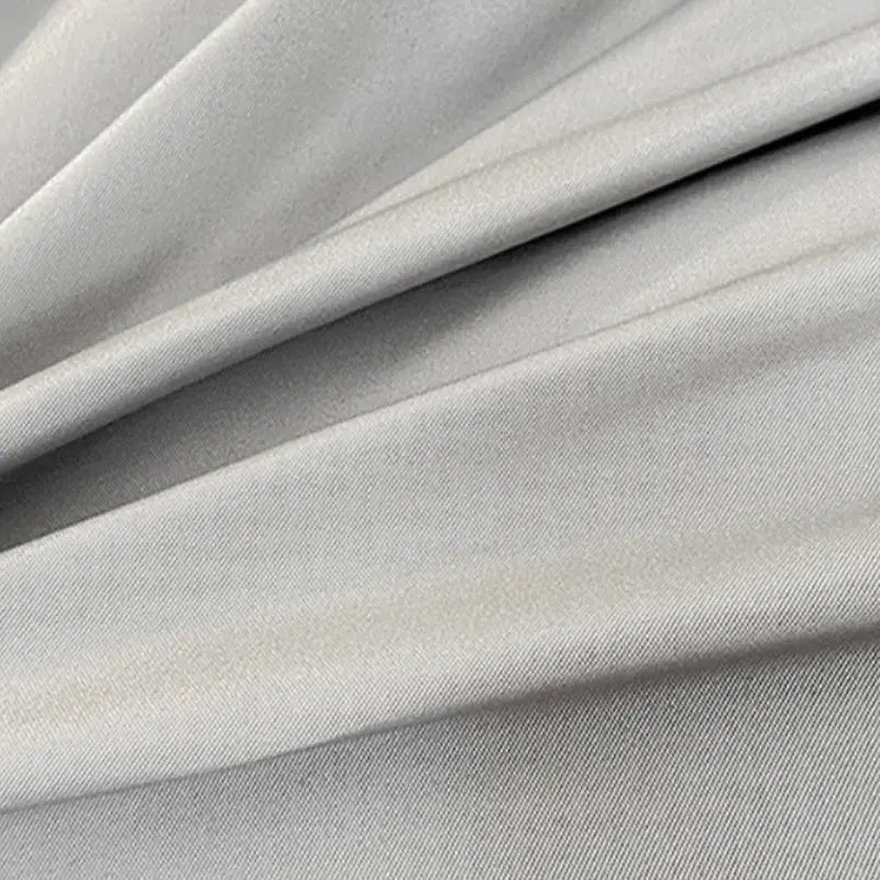 Light gray smooth textured fabric with subtle sheen in gray double color blocked ice silk bedding set duvet cover