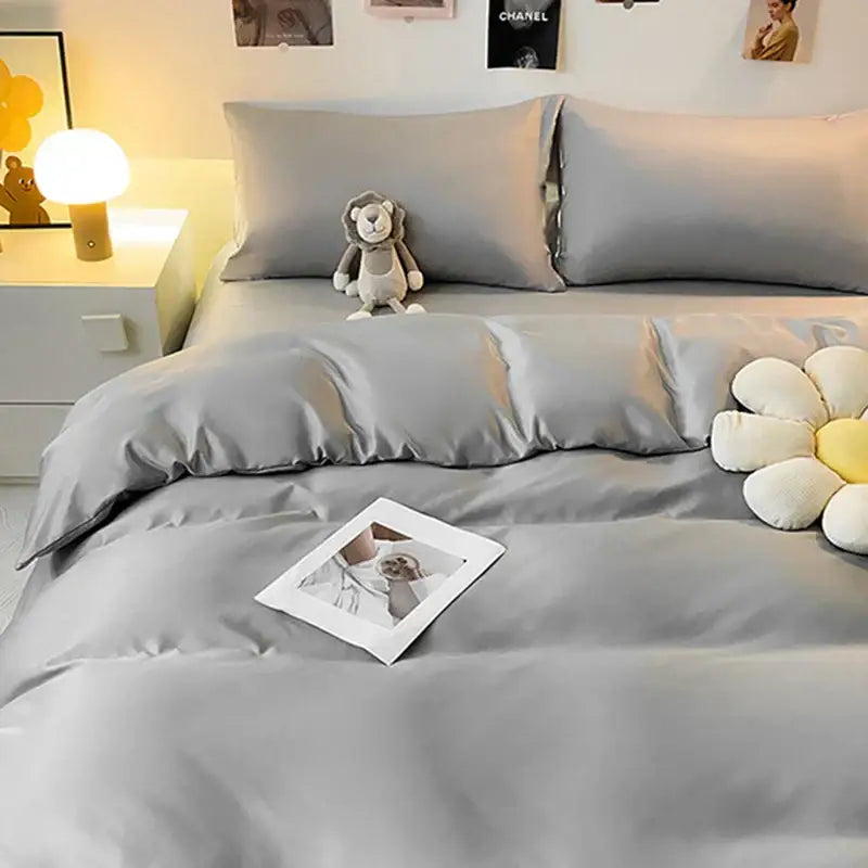 Gray double color blocked ice silk bedding set with satin-like duvet cover featuring smooth glossy finish and subtle sheen