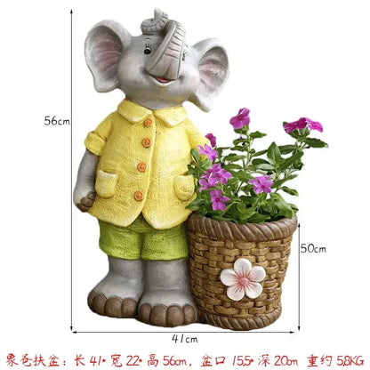 Gray ceramic elephant garden decoration dressed in yellow jacket holding basket planter with purple flowers
