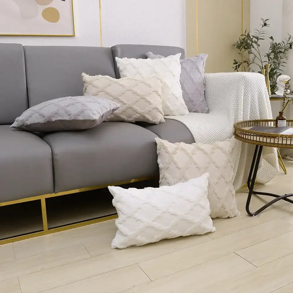 White textured throw pillows with diamond pattern featuring decorbites fluffy embroidery cushion cover on gray sofa
