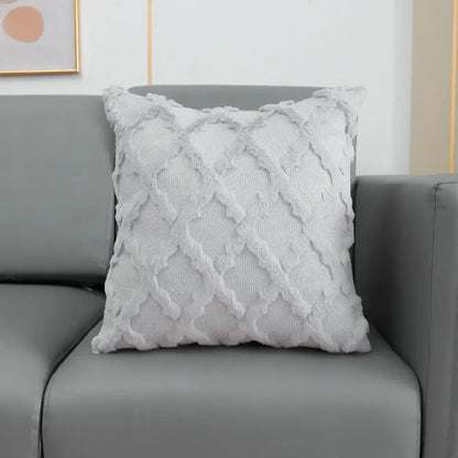 A soft light gray cushion cover with textured diamond pattern and frayed edges featuring decorbites fluffy embroidery decor