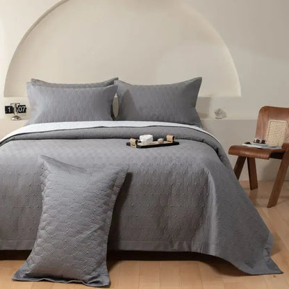Gray geometric quilted egyptian cotton bedspread set with subtle pattern and matching pillows for bedroom use