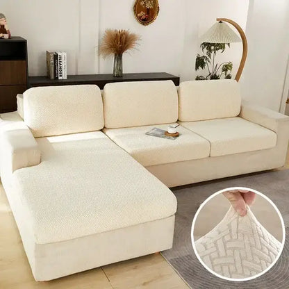 Cream-colored textured fabric sofa cover with subtle woven pattern for gray herringbone stretch living room protector