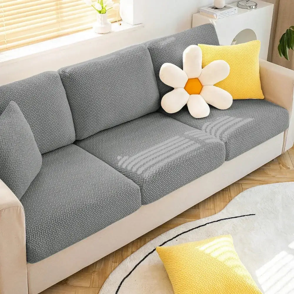 Gray herringbone stretch sofa seat cover with soft textured fabric for living room furniture protection