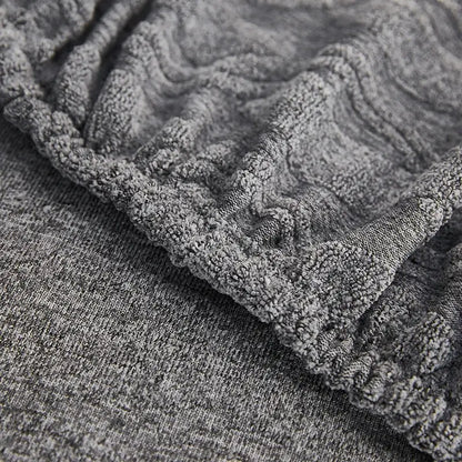 Gray jacquard sofa seat cover with plush gray textured cable-knit fabric for living room furniture protector decorbites