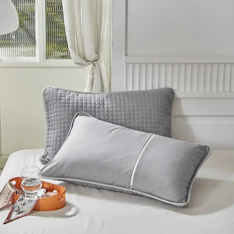 Gray quilted cotton pillowcase shield with subtle diamond pattern and white piping for bedroom sweat protection by decorbites cotton