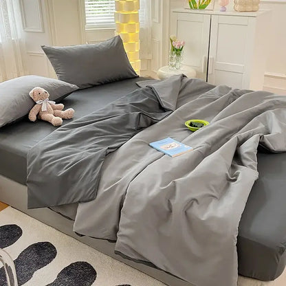Gray satin cotton quilted duvet cover bedroom bedding set with matching pillowcases and slightly wrinkled duvet cover
