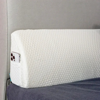 Gray memory foam bed wedge pillow with white honeycomb texture and built-in phone pocket for mattress gap filler