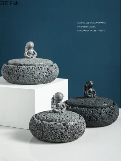 Gray volcanic stone cement astronaut ashtray with miniature astronaut lids designed by zizi fish for living room use