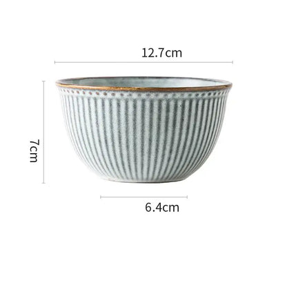 A ceramic wedding tableware bowl with vertical ridges, muted sage green glaze, gold rim from a decorbites set