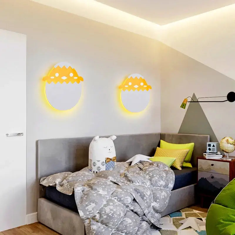 Two circular yellow-lit wall lamps with a playful eggshell design decorbites dino egg led wall lamp for bedroom decor