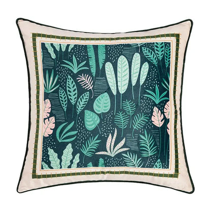 Square cushion cover with vibrant teal green pink tropical leaves on dark background and off-white geometric tufted embroidery detailing by decorbites