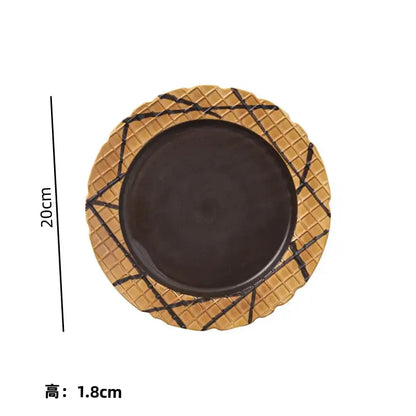 A creative biscuit ceramic round plate with a golden-brown waffle rim and dark brown center for biscuit ceramic tableware