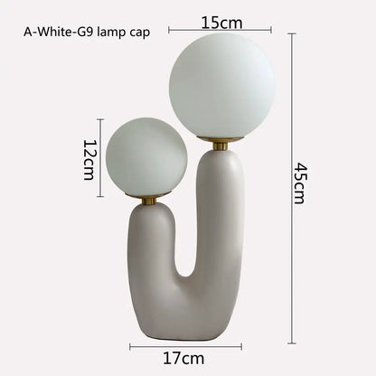 Modern minimalist green ceramic table lamp with double frosted glass spherical shades for bedroom lighting