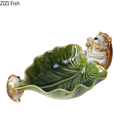 Green ceramic leaf decor tray with glossy ceramic leaf and whimsical porcupines for dining room storage by decorbites
