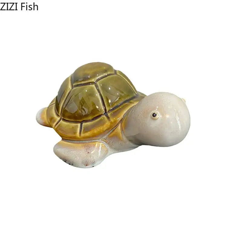Glossy olive green ceramic turtle statue with segmented shell and creamy white limbs for desk decoration