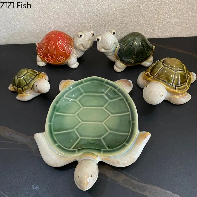 Green ceramic turtle statue desk decoration with hexagonal shell pattern and cream-colored limbs trinket dish