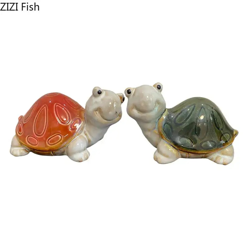 Two ceramic turtle statue desk decorations with glossy orange and green shells and smiling faces for bedroom trinkets