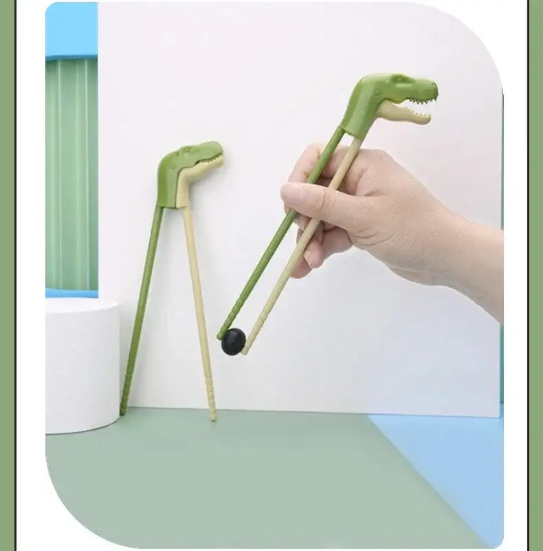 Green dino chopsticks kids training set with wooden handles and plastic dinosaur heads by decorbites for dining room use